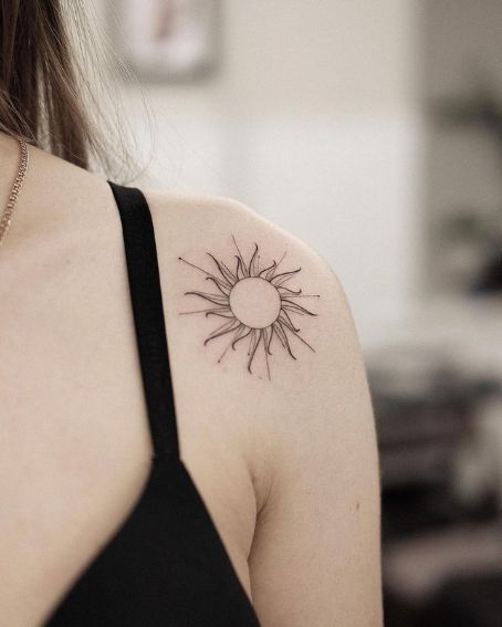 Simple And Elegant Black Sun Tattoo