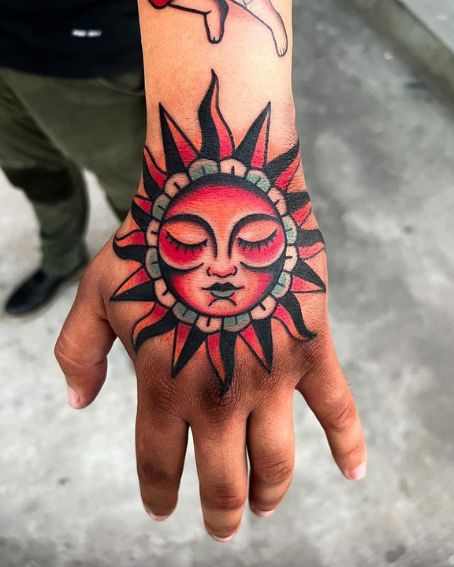 The Sleeping Sun Tattoo In Pink And Black Color Combination