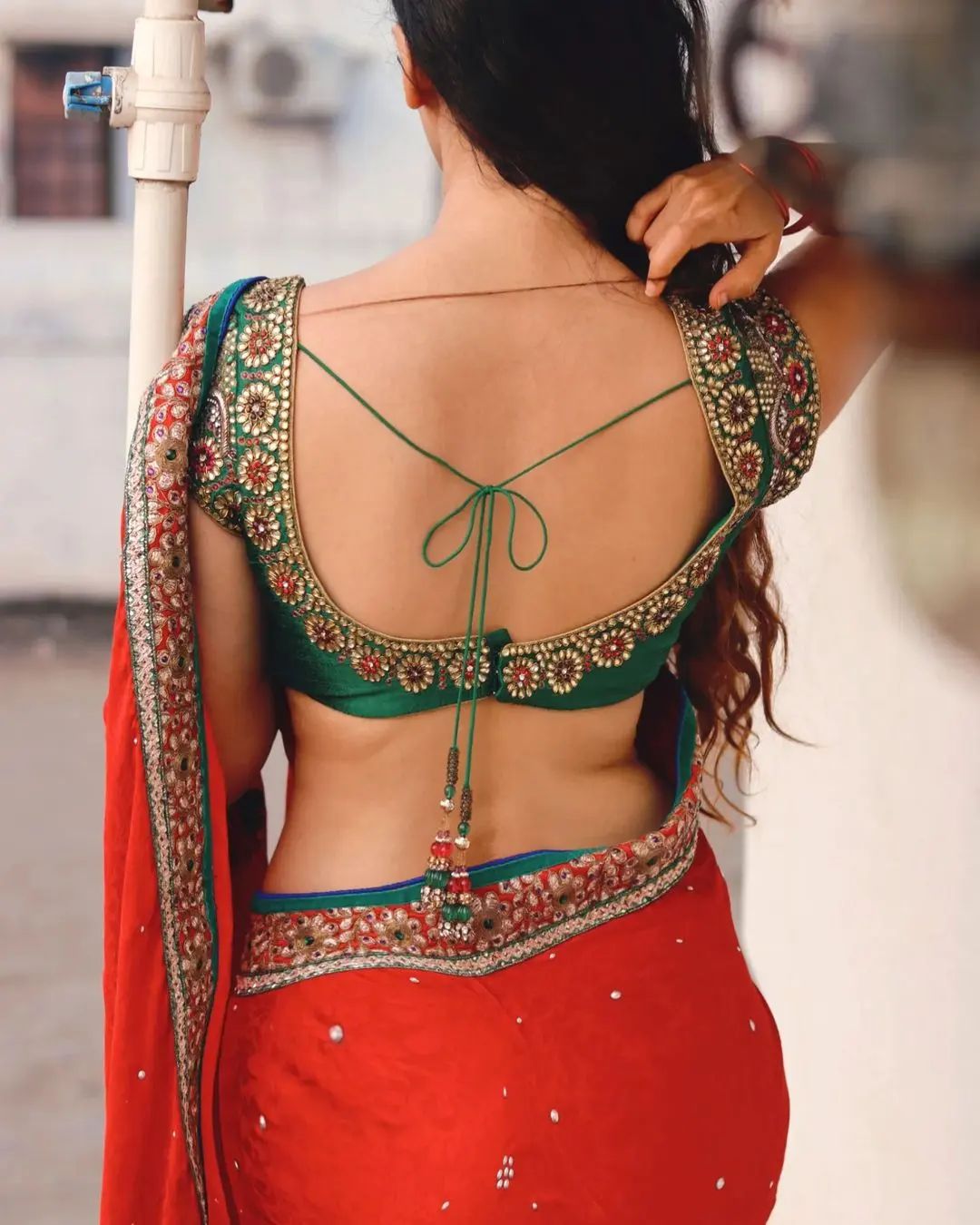 Dazzling Ornamental Backless Blouse Design