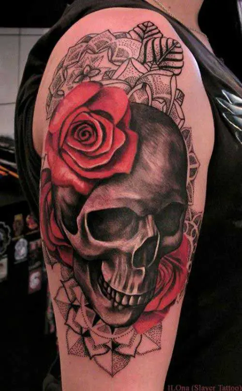 A big skull tattoo with red rose for forarms