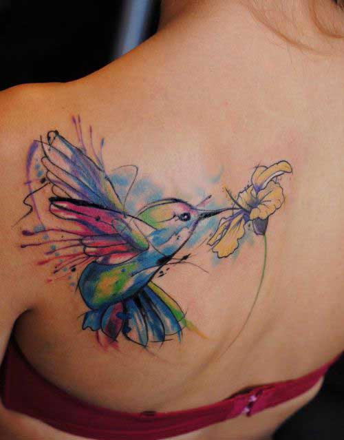 A colourful humming bird with flower on back
