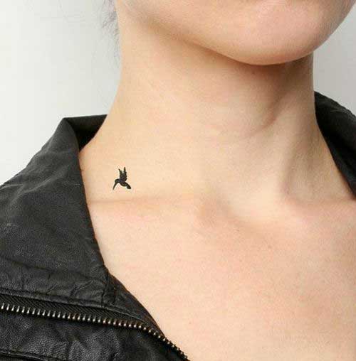 A small black and cute humming bird on neck
