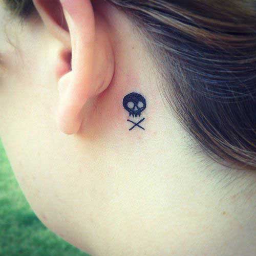 A small black skull tattoo back of the year
