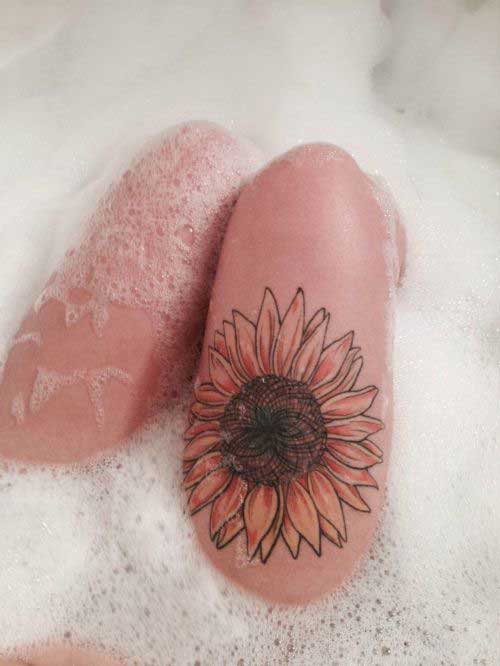 Big sunflower on the thigh