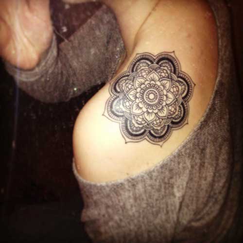 Black color flowery mandala on the shoulder