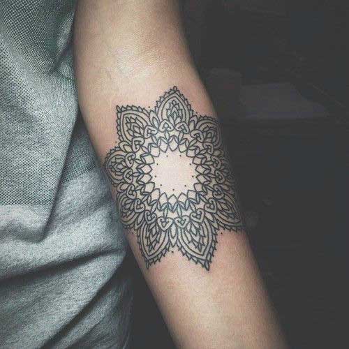 Black mandala on the hand