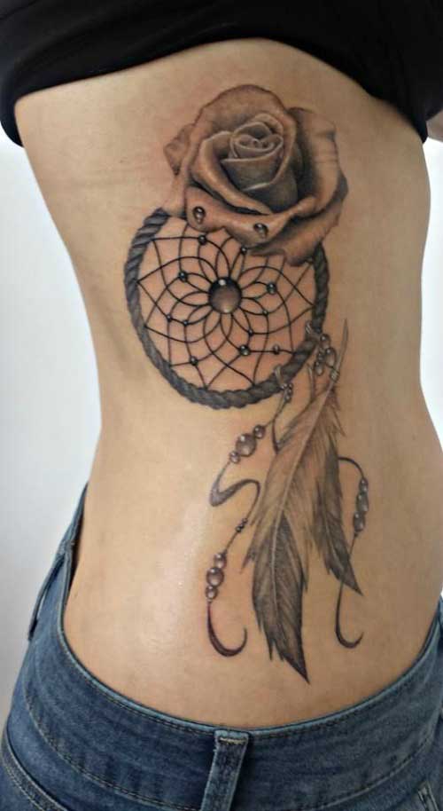 Dream cather with rose and feather on the ribs