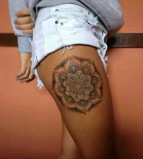 Elaborate black color mandala on the side portion of the thigh