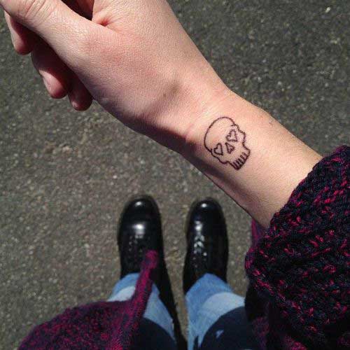 Simple black color tattoo on the wrist