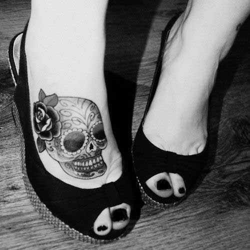 Tattoo with rose on the feet