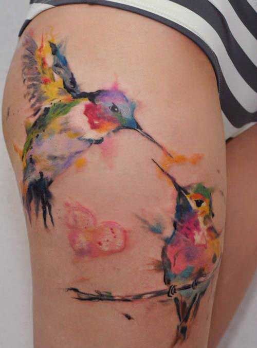 Two Colourful Humming Birds On Thighs
