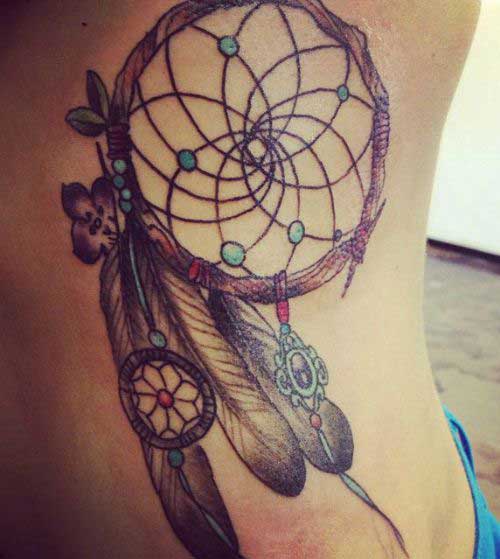 one dream catcher and one hoops on three feather on the ribs