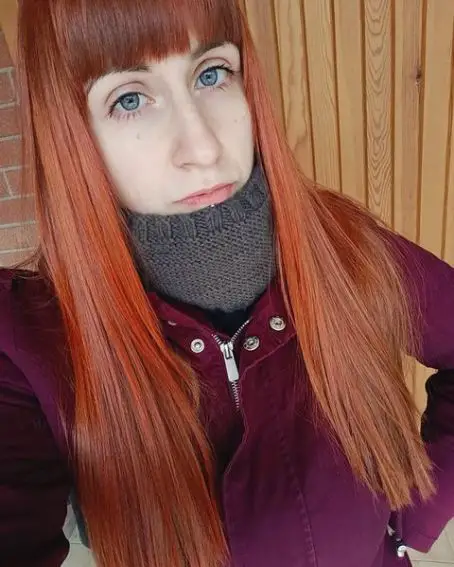 Long And Straight Copper Red Hairstyle With Front Bangs