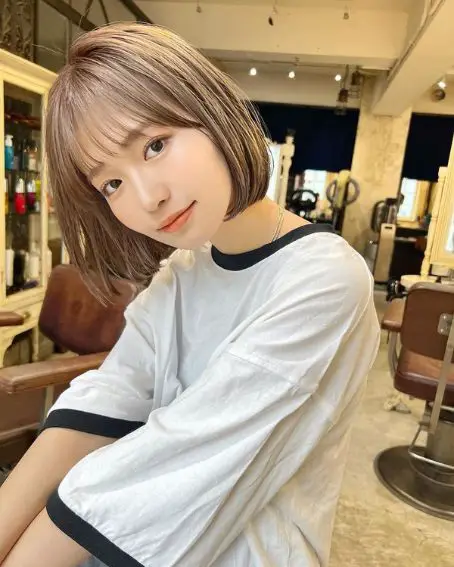 Simple Bob With Curtain Bang Hairstyle For Round Faces