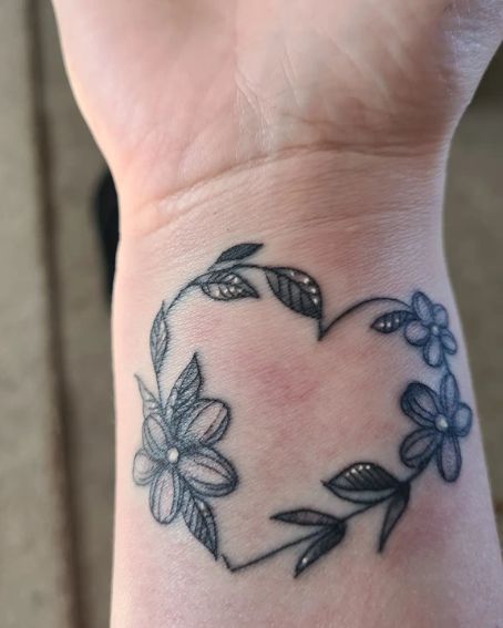 Heart Shape Flower And Leaves Garland Tattoo