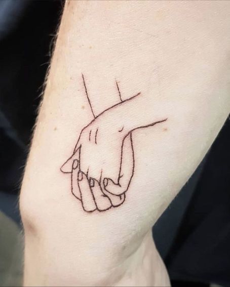 Handholding Love Tattoo On Wrist