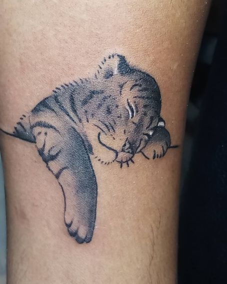 Sleeping Tiger Tattoo On A Wrist