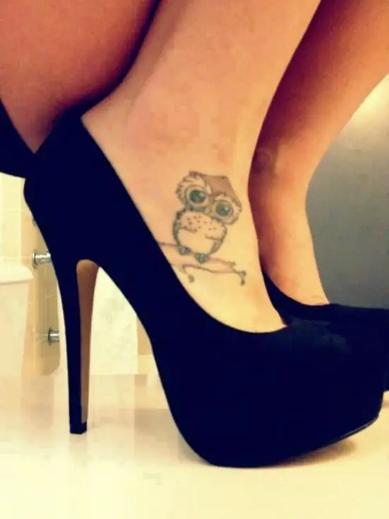 tiny owl tattoo on foot