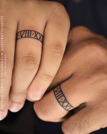 Roman Number In Fingers Couple Tattoo