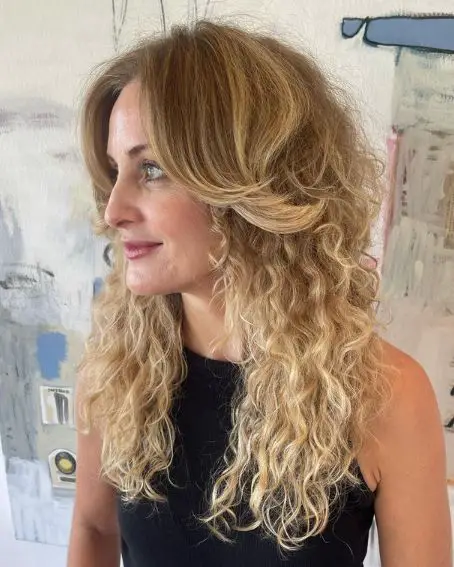 Wispy Curtain Bangs With Long Blonde Curly Hair