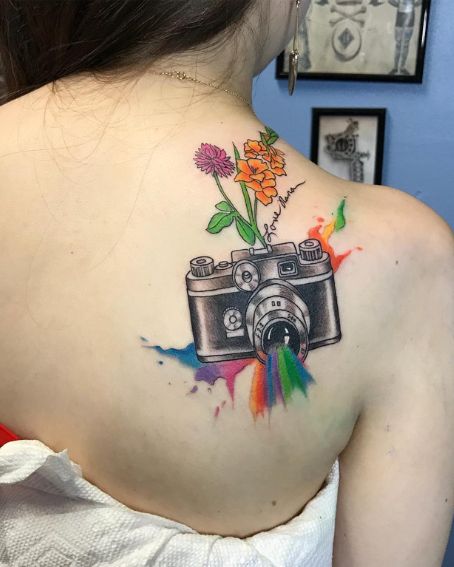 Beautiful Tattoo Of Camera With Flowers