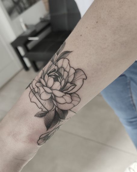 Flower With Leave Tattoo On Wrist