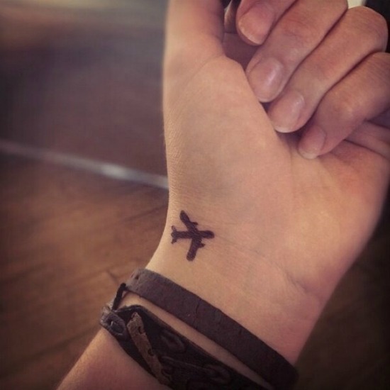 Small Plane Tattoo on Wrist