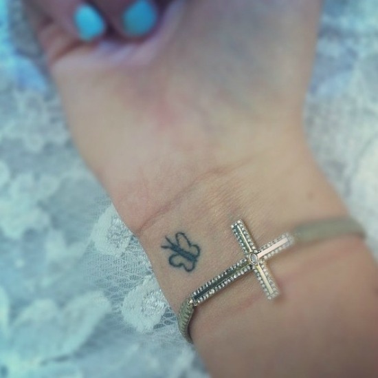 Tiny Butterfly tattoos on wrist