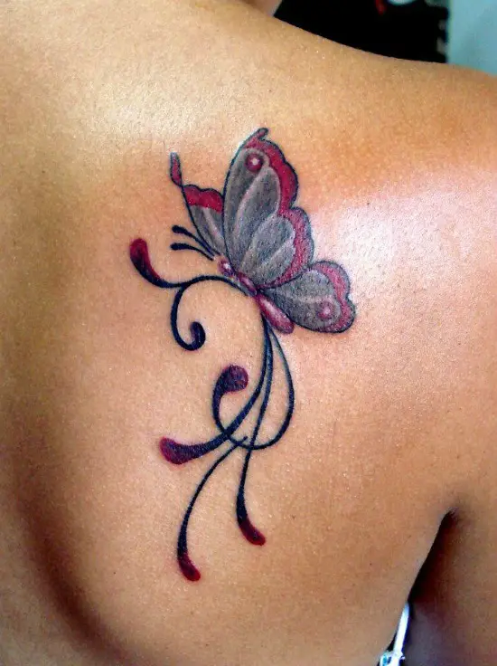 colorful butterfly tattoo on back shoulder