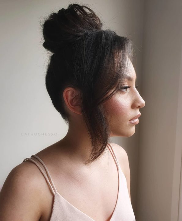 High bun with heavy side fringe