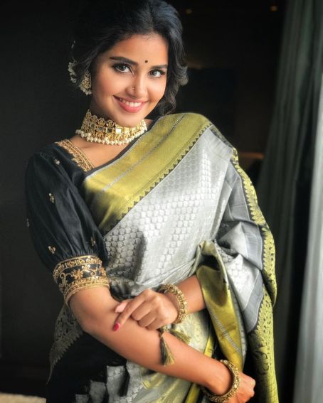 Anupama in Black and Gold Ash Pattu Saree