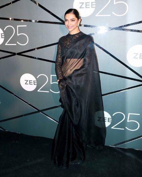Bold Deepika In Black Glossy Black Saree With Blouse