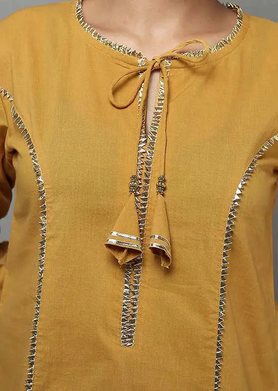 14 A beautiful tie neck kurta with tassels