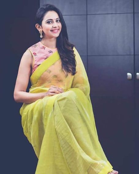 Rakul Preet Singh In Lemon Yellow with Sheer Yoke Neck Floral Blouse