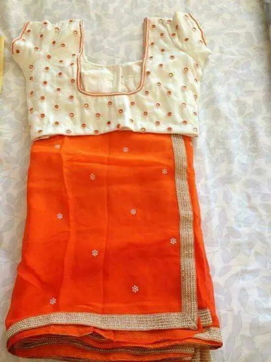 Orange Saree With Pearl Motifs Along With Cream Mirror Work Blouse