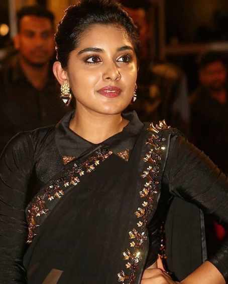 Nivetha Thomas in Heavy Worked Border Black Saree with Shirt Collar Blouse