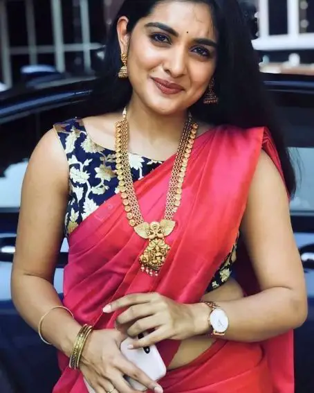 Nivetha Thomas In Hot Pink Saree and Blue Brocade Blouse