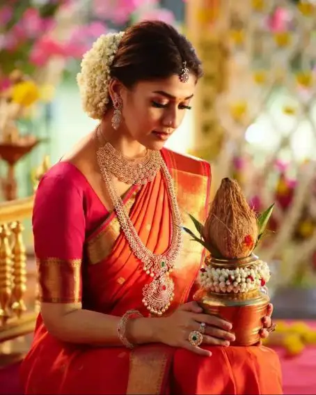 Nayanthara In An Orange Silk Saree With A Pink Blouse
