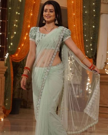 Pastel Green Net Saree Paired With Puff Blouse