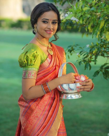 Sri Divya In Orange Silk Saree