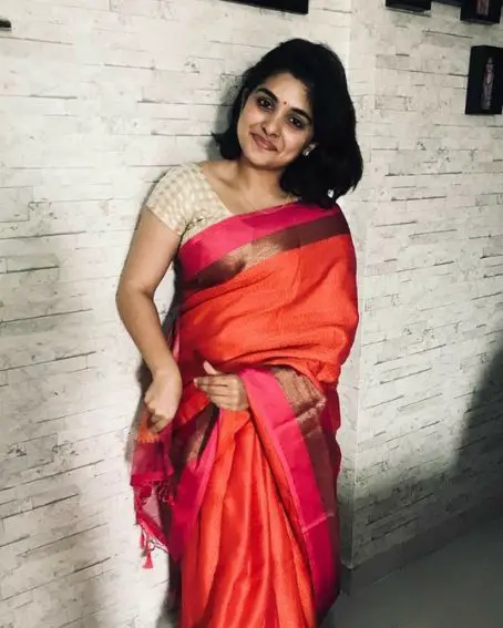 Nivetha Thomas in White Saree with Zari Border