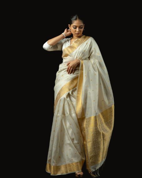 Elegant White And Gold Toned Saree