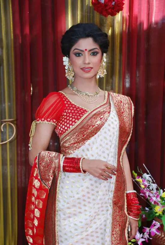 White Saree With Red Zari Border Paired With Sheer Puff Sleeves