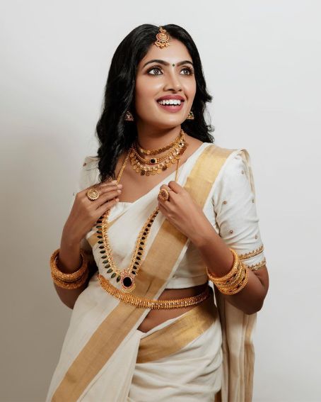 White And Gold Kerala Wedding Saree And Blouse 