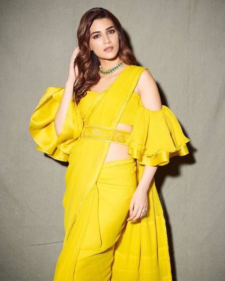 Kriti Sanon In Yellow Slim Saree With Raffle Fancy Blouse