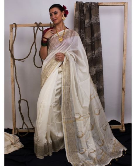 Gorgeous White Saree With Gold Sequins Work