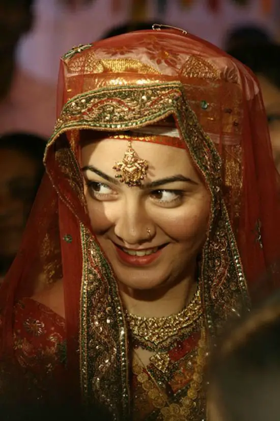 Kashmiri Bride In Gold Lehenga With Long Blouse