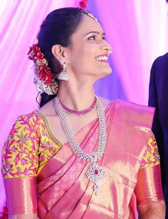 Pink kanchipuram sari with contrast yellow blouse