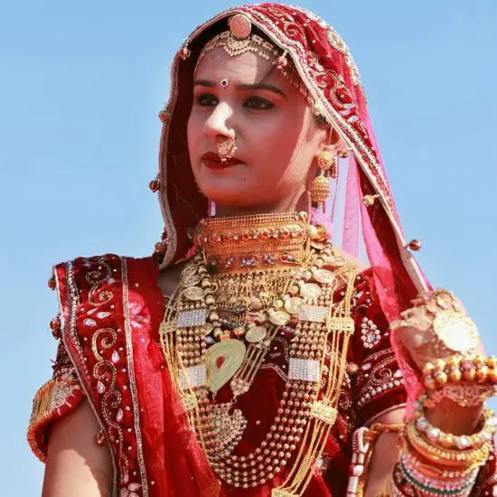 Rajasthan Bride Wearing a Saree With a White Base and Red Designs