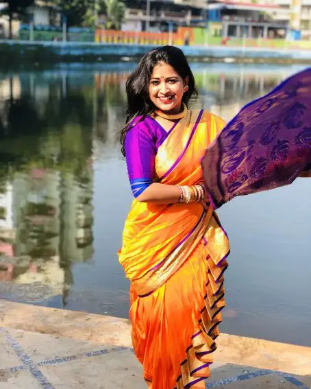 The Dazzling Yellow And Purple Nauvari Saree